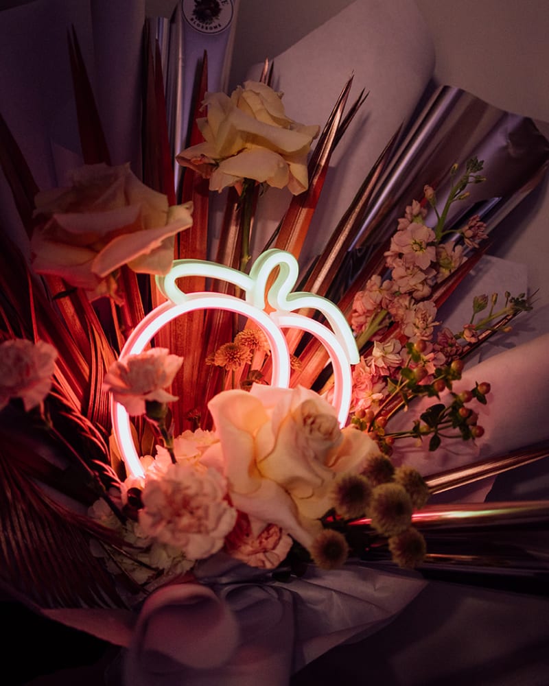 neon peach light and flowers 