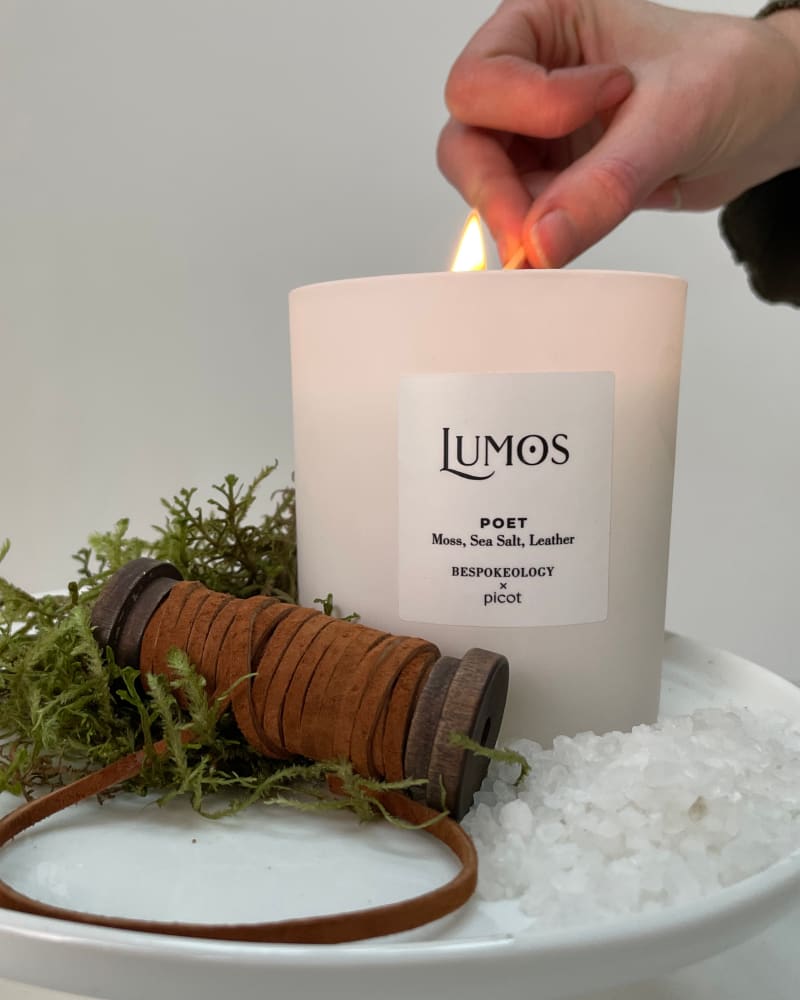 Lumos Poet candle being lit