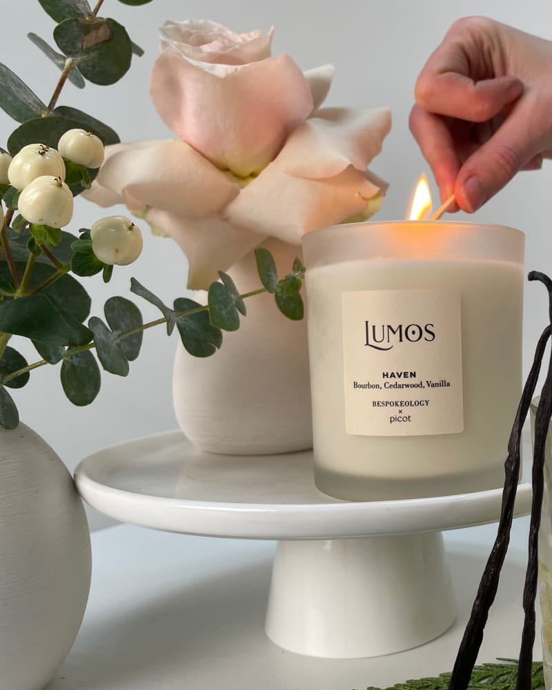 Lumos Haven candle being lit