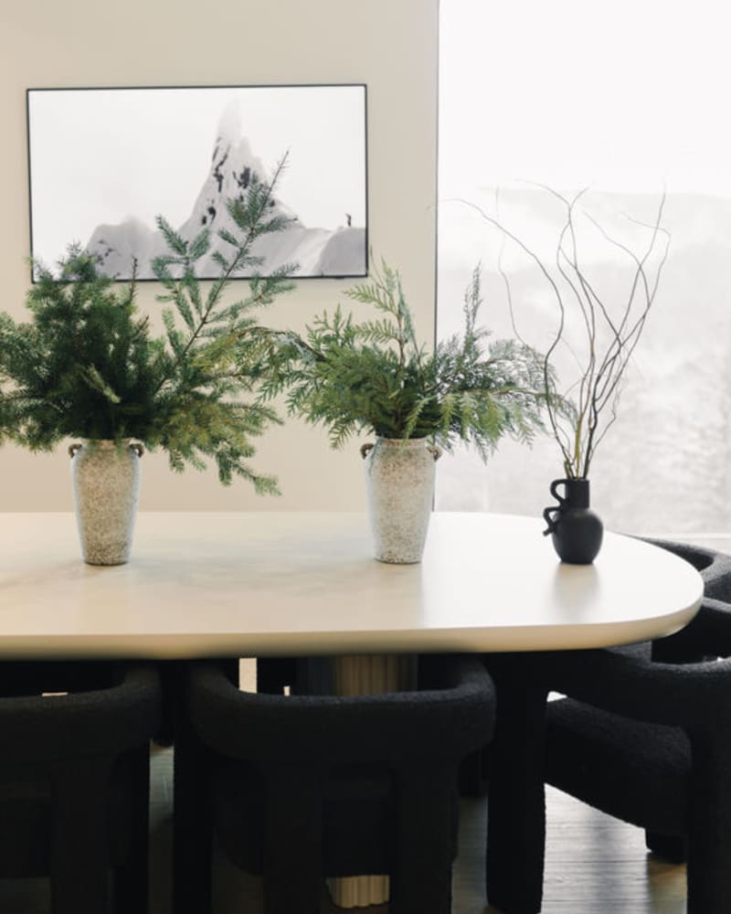 vases full of fresh holiday greenery