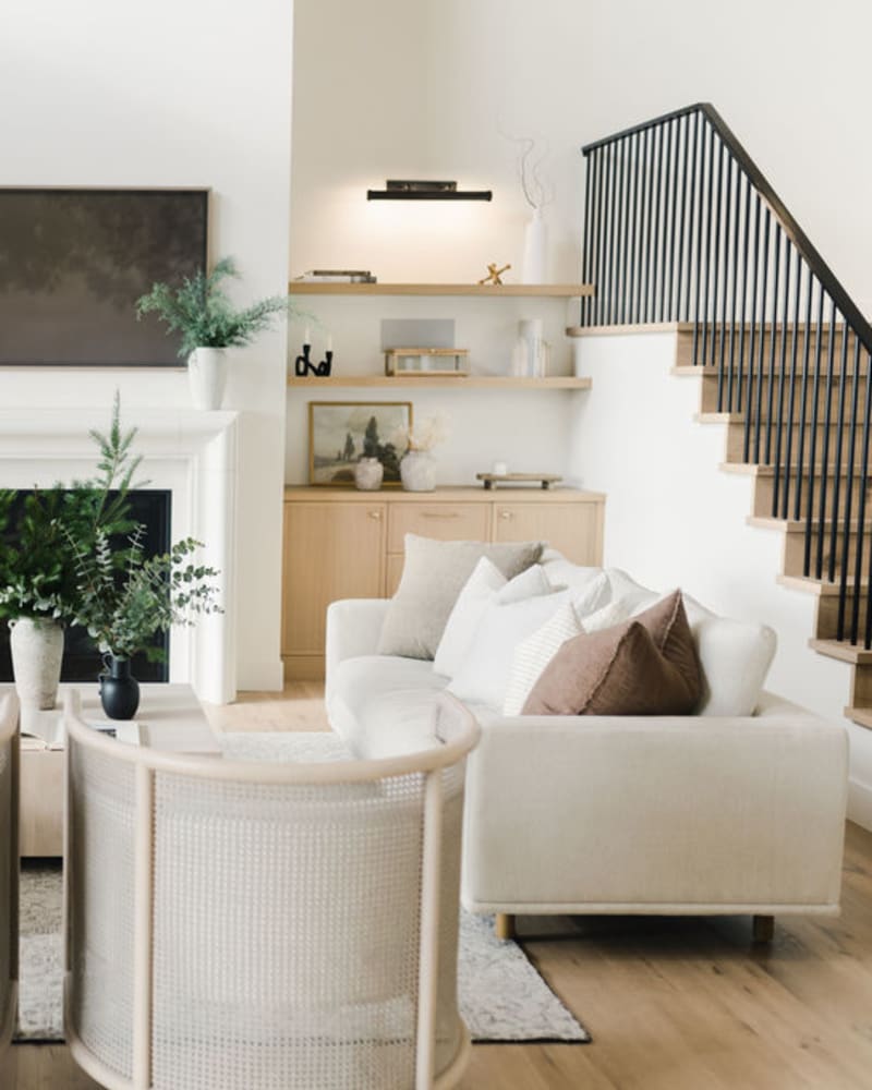 beautiful living room with vases of greenery