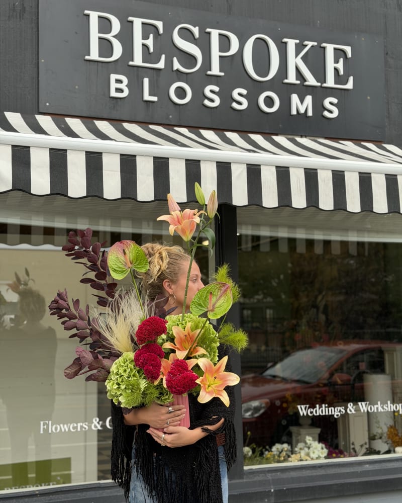 Funky floral arrangement in raspberry and green tones 