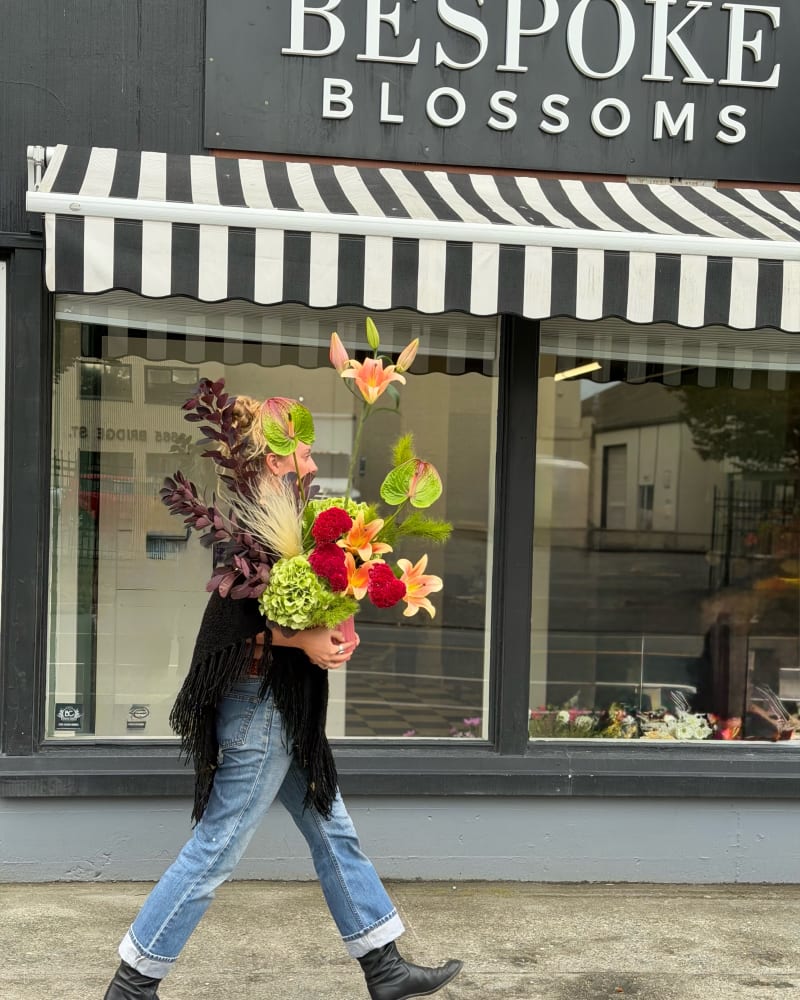 Funky floral arrangement in raspberry and green tones