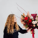 Woman holding holiday bouquet 