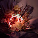 neon peach light and flowers 