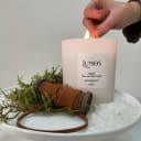 Lumos Poet candle being lit