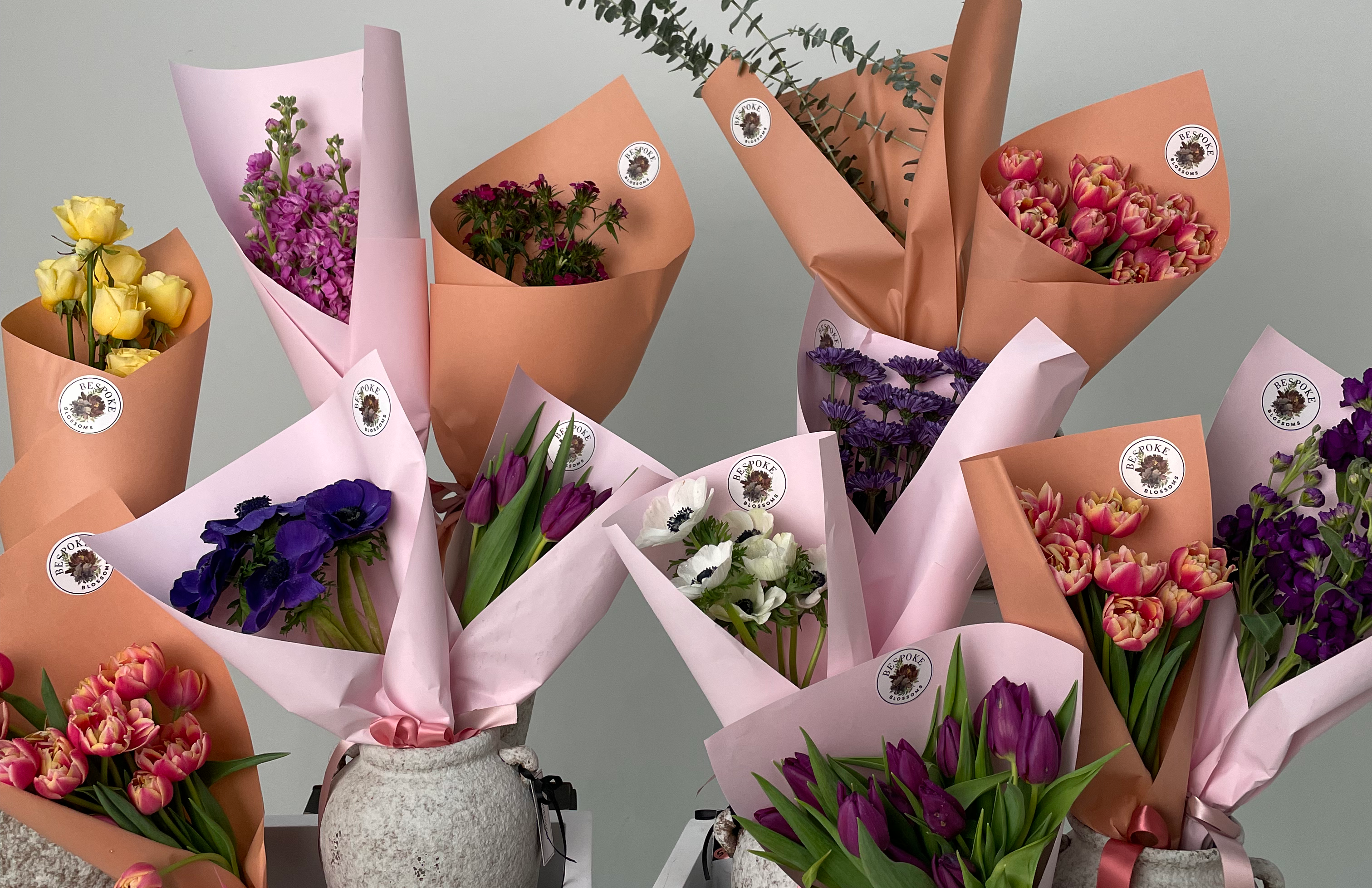 Spring flower bundles wrapped in decorative paper