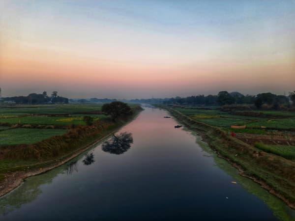 Serene River Horizon, Sunset Over Countryside Fields
