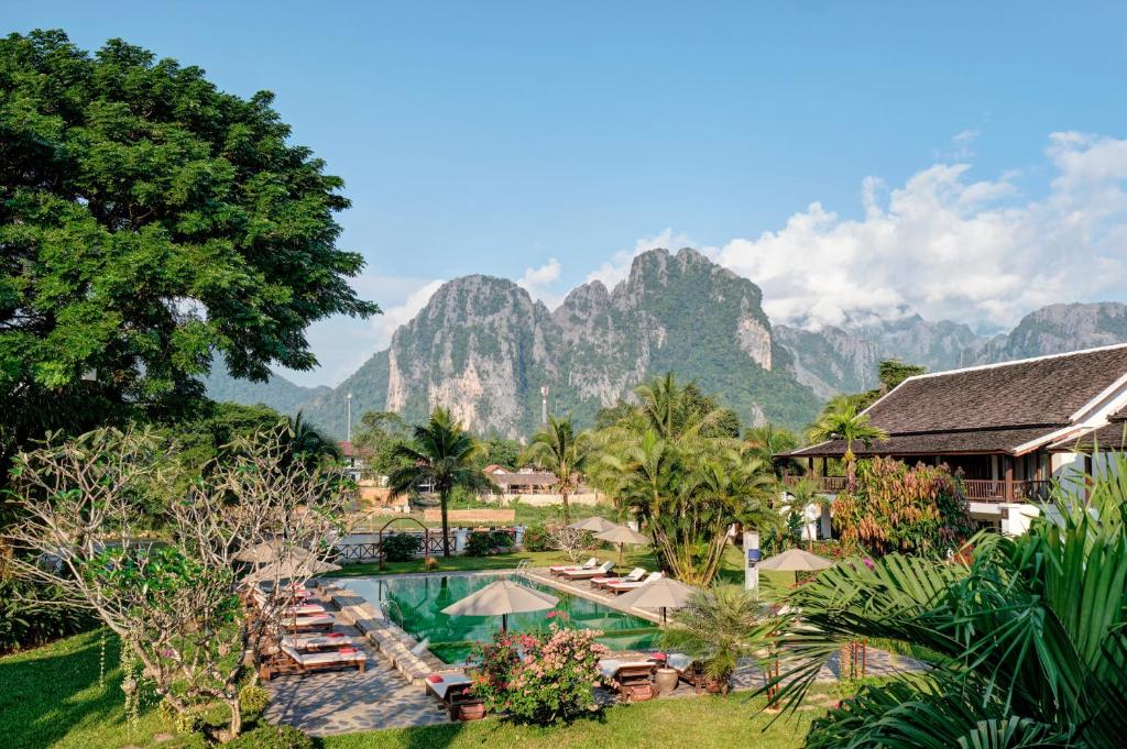 Riverside Boutique Resort pool and karst views, Vang Vieng