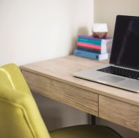 desk with chair and mac book
