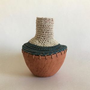 clay vessel with fiber decoration