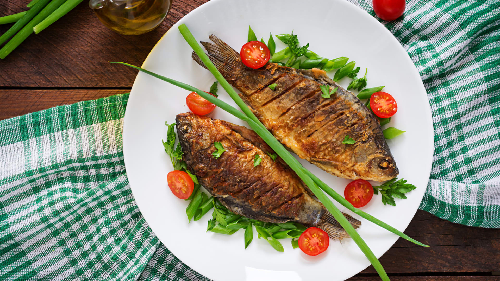Fish served comes alive on Plate, Bites chopsticks at a restaurant in
