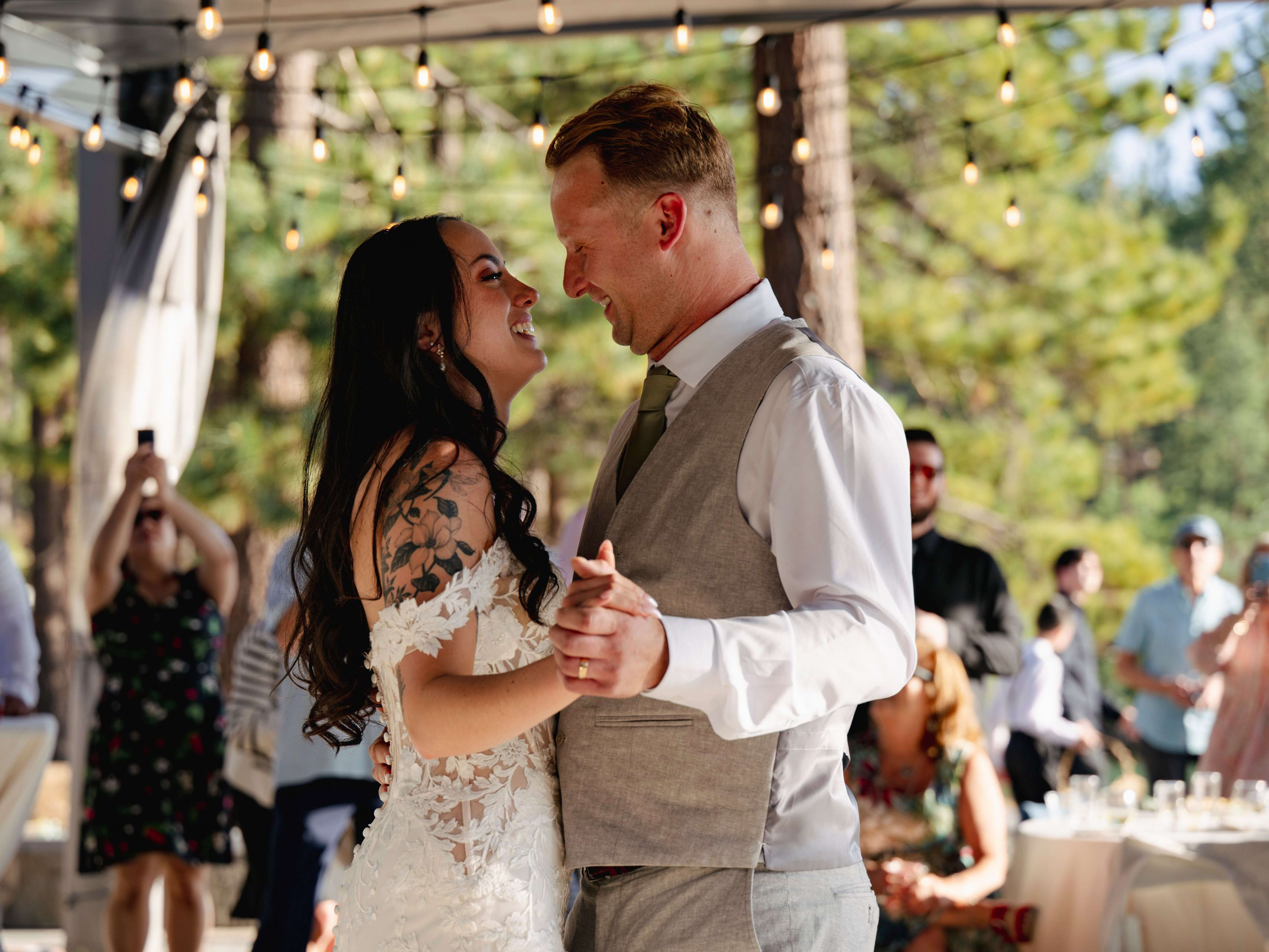 wedding couple dancing on the edge of Lake Tahoe