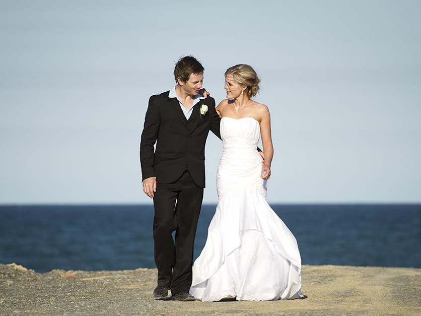 wedding couple walking on the beach