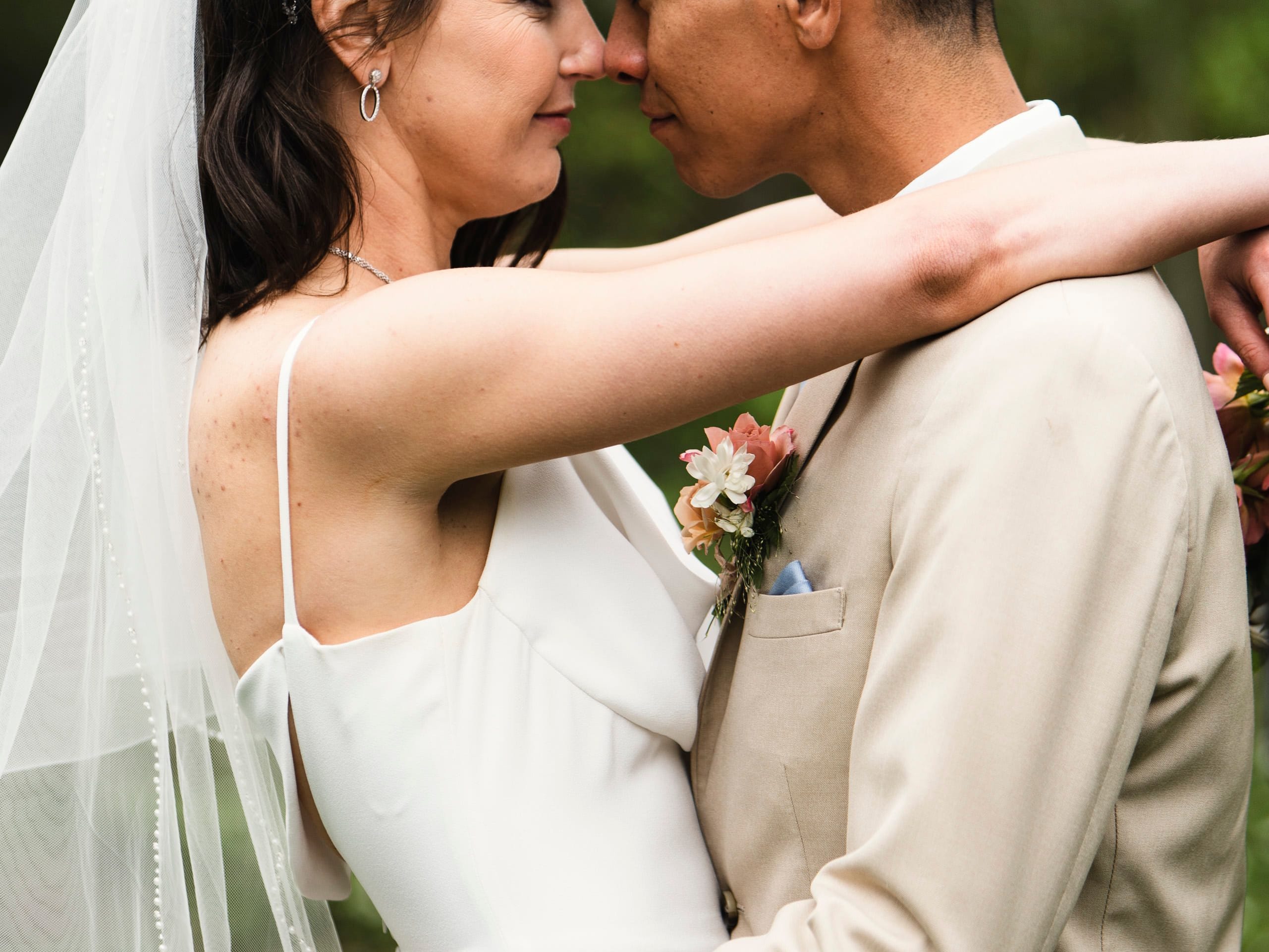 wedding couple in close embrace