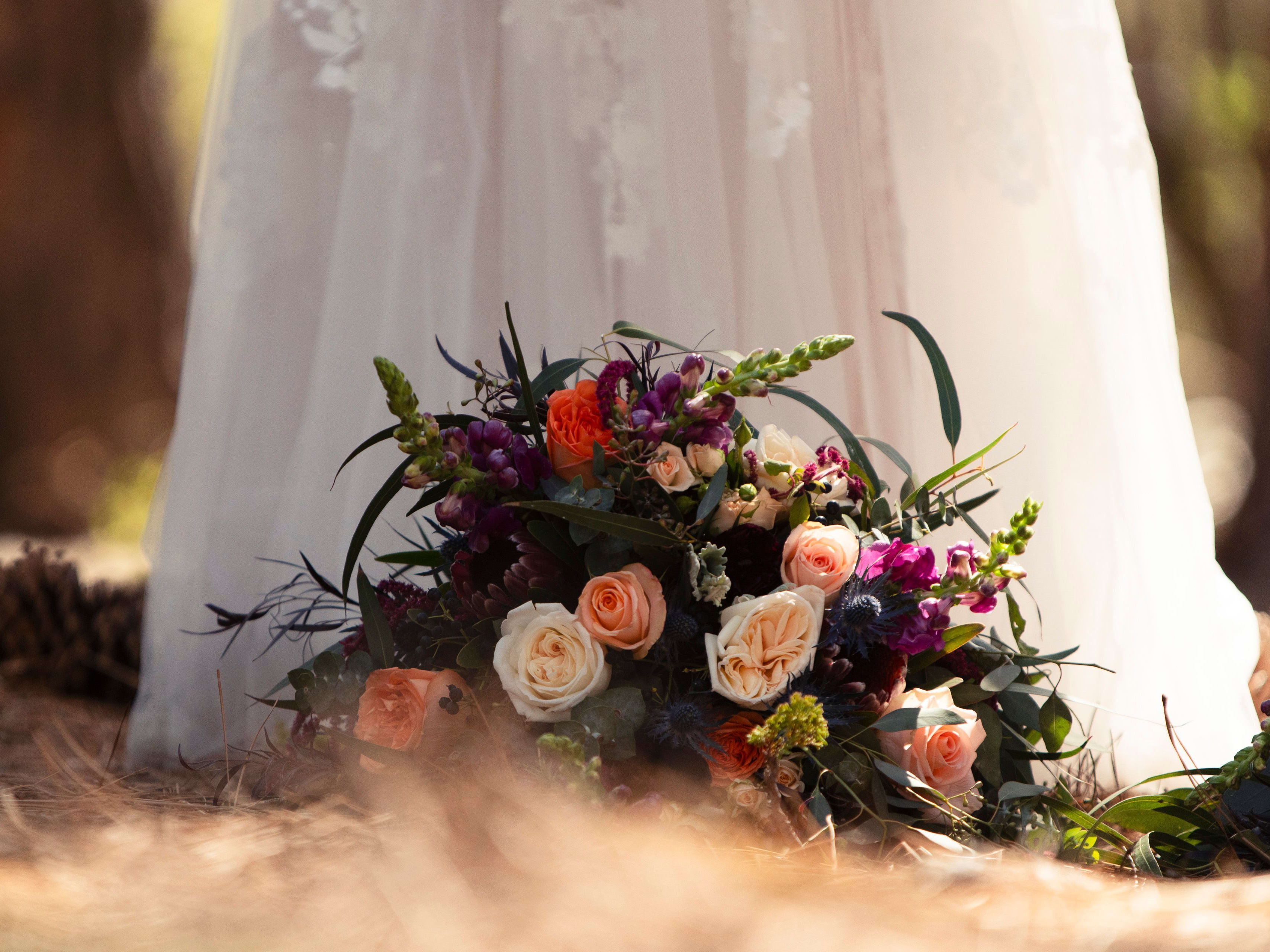 wedding flowers ay a brides feet