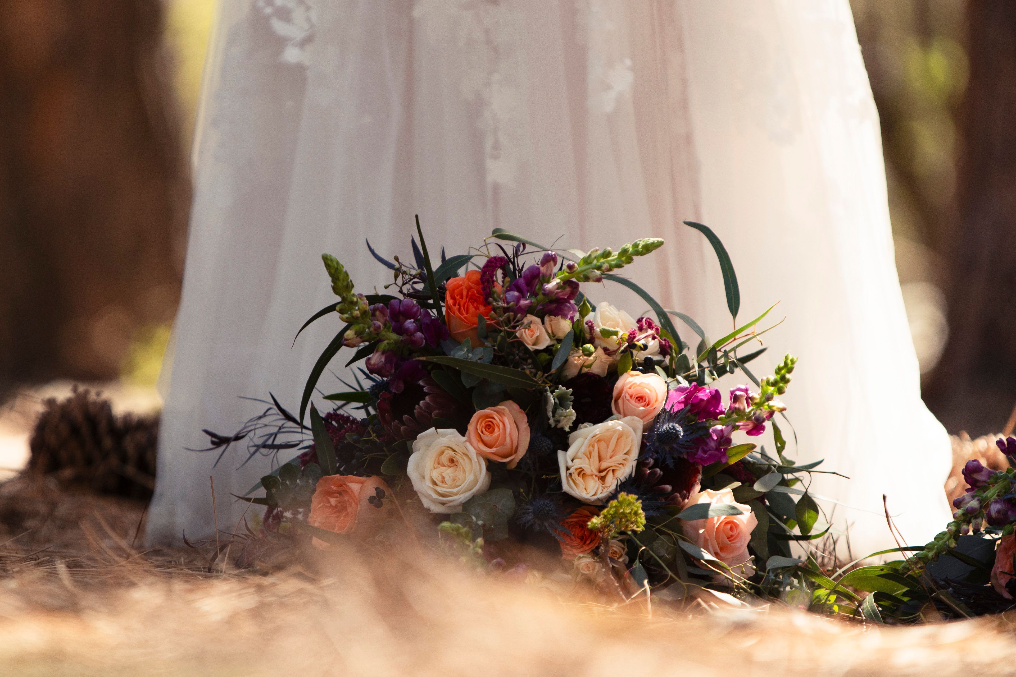wedding flowers ay a brides feet