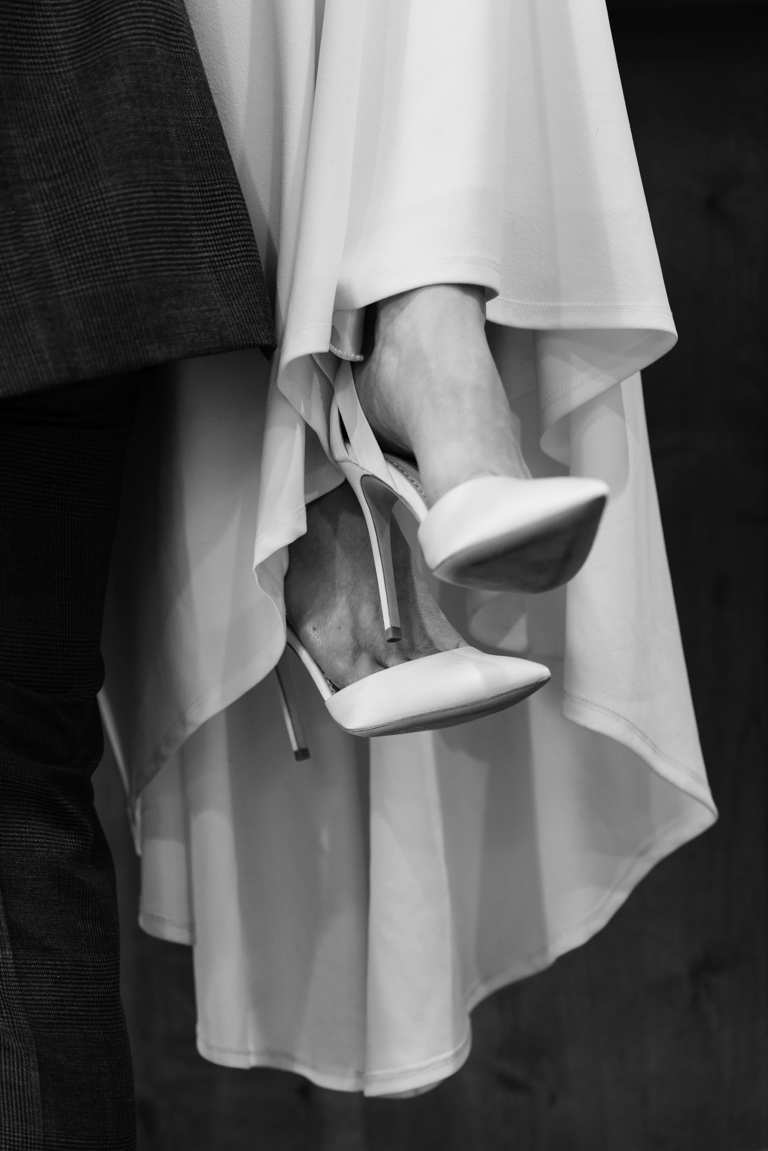a brides shoes framed by her dress | Stacey & Charlie