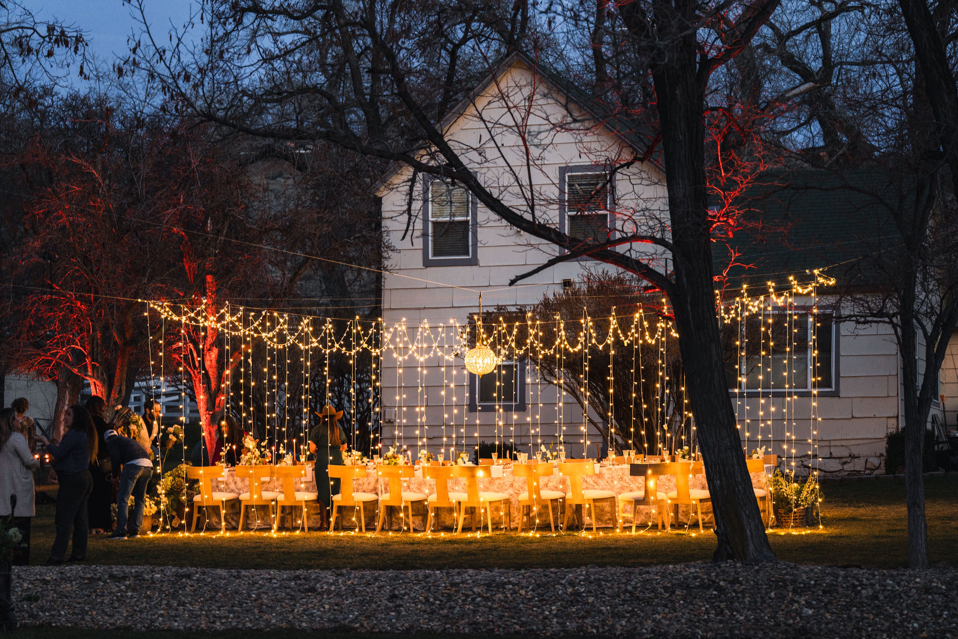 wedding reception table wrapped in lights | null & null