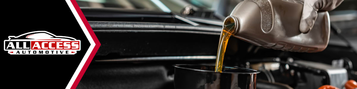 Fresh motor oil being poured during an oil change