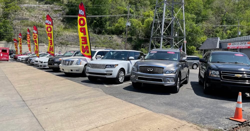 Pre-owned SUVs and cars lined up on the lot at All Access Automotive in New Brighton, PA
