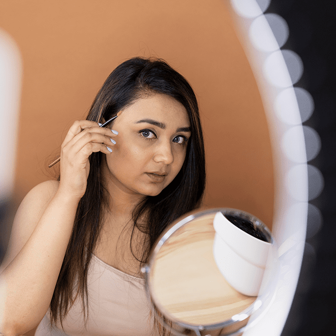 Woman noticing her flaws in a mirror showing body dysmorphic disorder self-perception