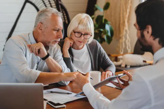Photo of couple working with broker