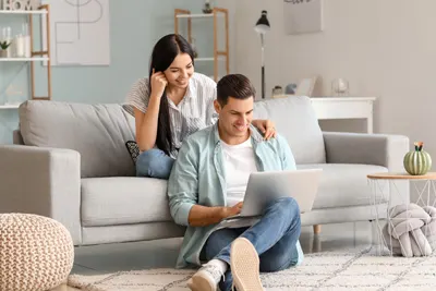 Couple looking at laptop