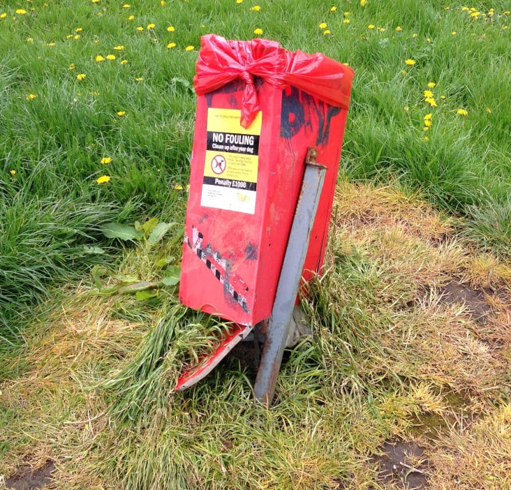 The vandalised bin in Sunny Bank Wood, daubed with offensive graffiti.