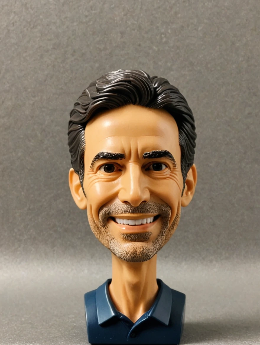 A plastic bobblehead doll with a big head