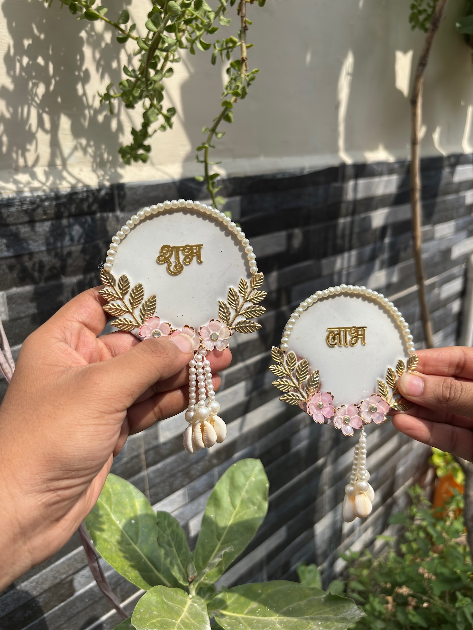 Shubh Labh Wall Hanging Set of 2 – White Round Design with Pink Flowers, Golden Leaves & Shell Tassels | Durva Creation
