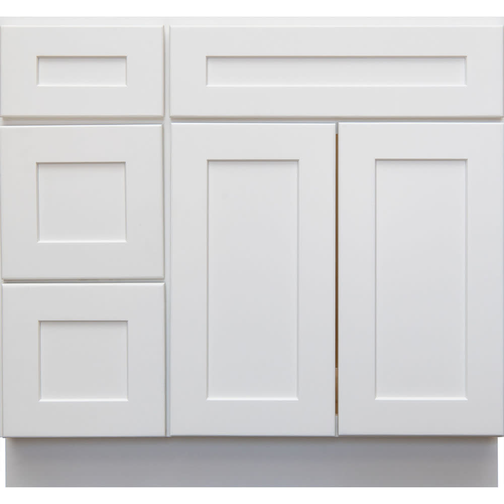 The sleek and crisp look of the whtie shaker vanity lends to placement in a modern or contemporary design. The minimal ornamentation and 5053006 Heritage White Shaker 36 LH Vanity With Drawers