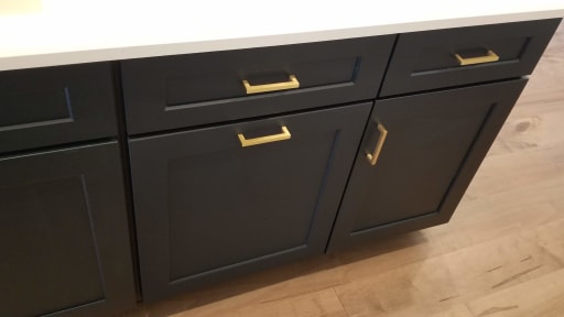 Green cabinet with champagne handles Night Watch Green cabinet with champagne handles