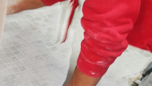 man tiling the floor man tiling the floor
