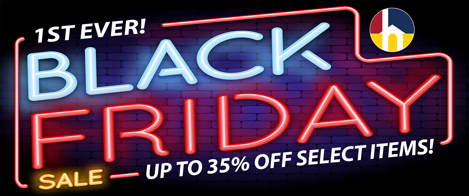 Woman in kitchen withblue shaker cabinets.