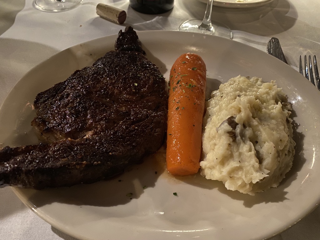 Plate with steak, carrot, and potatoes