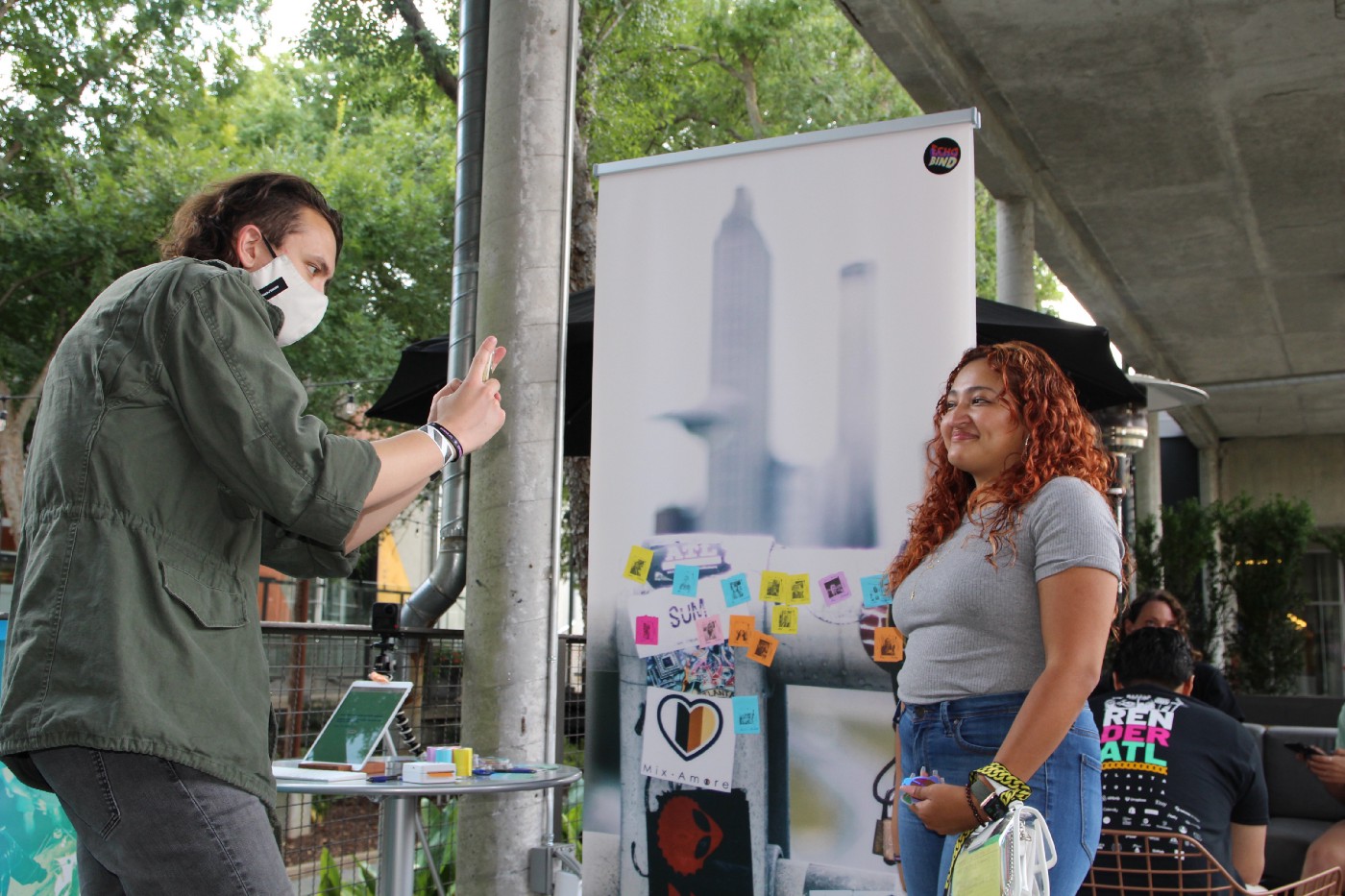 Echobind employee taking photo of a and creating a slappie