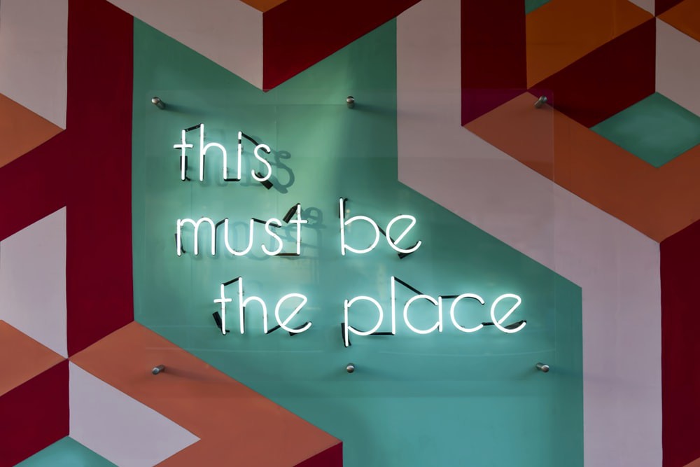 Picture with text that says this must be the place