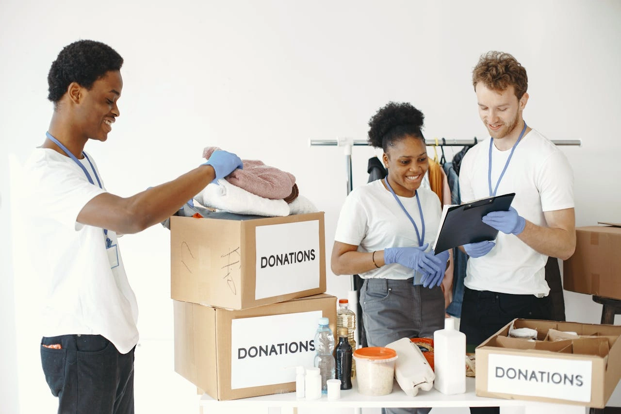 Furniture and clothing donations being dropped at a community charity center
