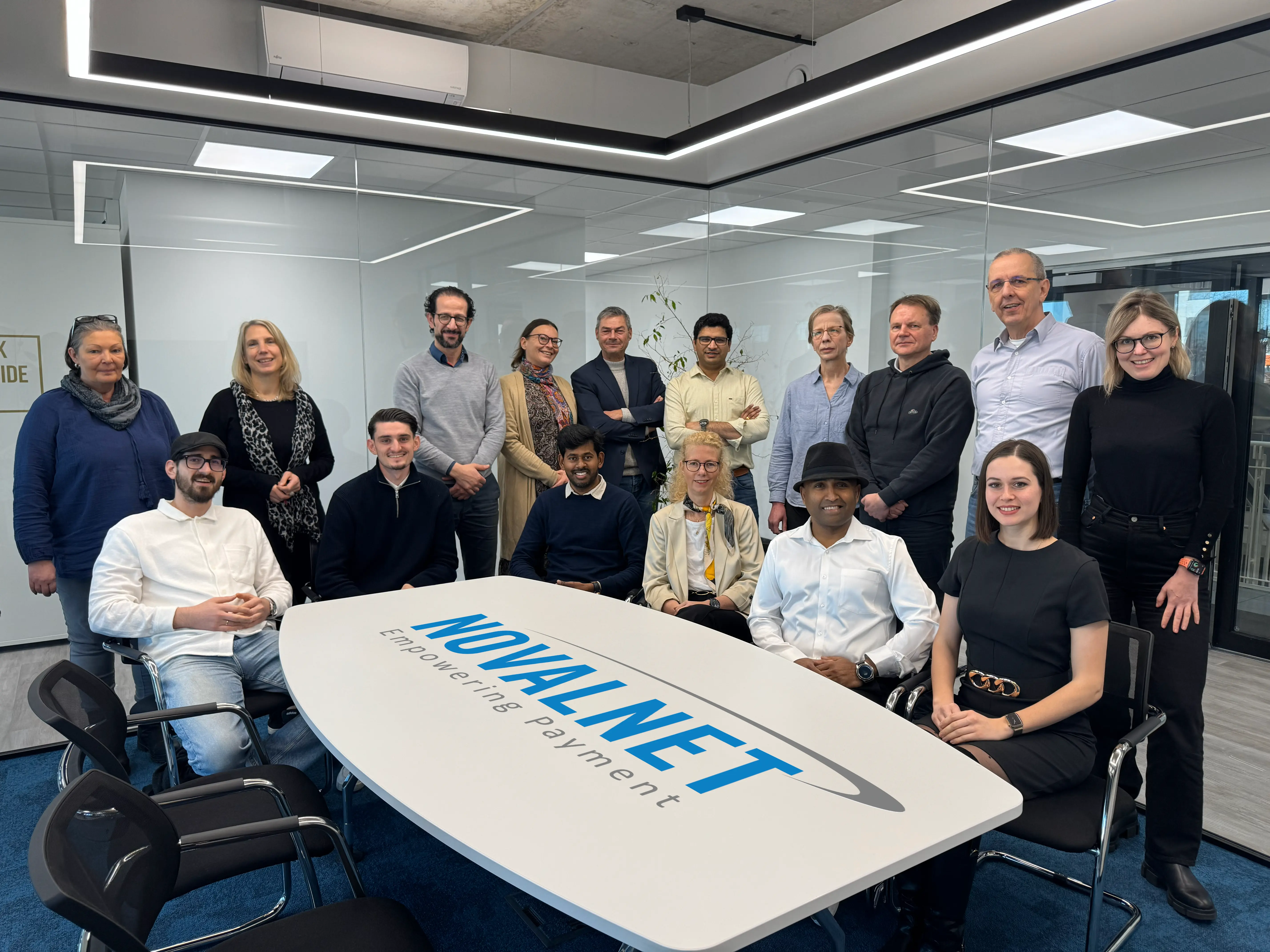 The photo showing the team of Novalnet AG with Gabriel Dixon, Founder & CEO in the middle