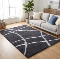 black grey white curved line pattern rug