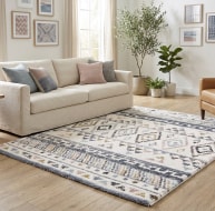 multicoloured geometric pattern rug