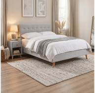 light grey fabric bed with button headboard wooden feet