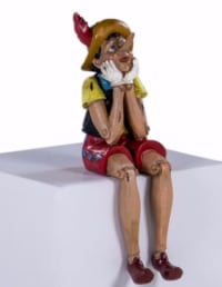 Antiqued Sitting Pinocchio Figure