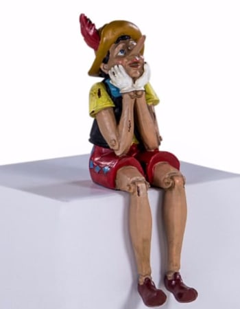 Antiqued Sitting Pinocchio Figure