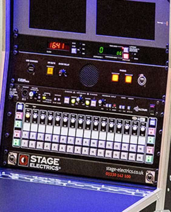 Upright stage management desk in black with headset and wand lights