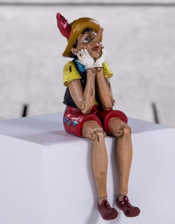 Antiqued Sitting Pinocchio Figure