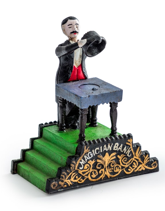 Cast Iron Magician Coin Bank 