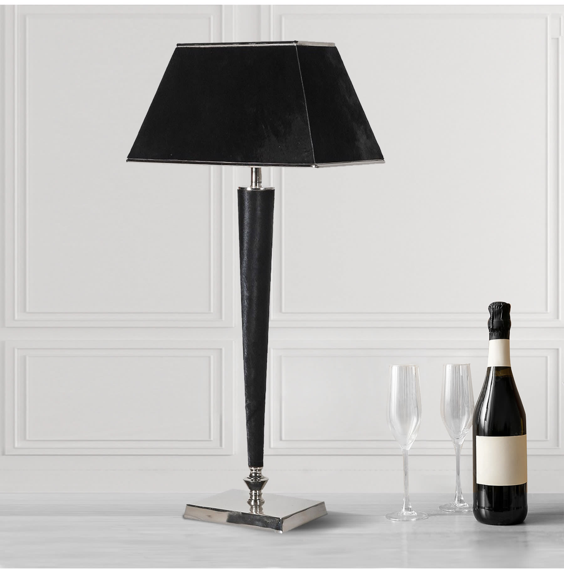 Polished metal table lamp with black texture lamp shade and stalk