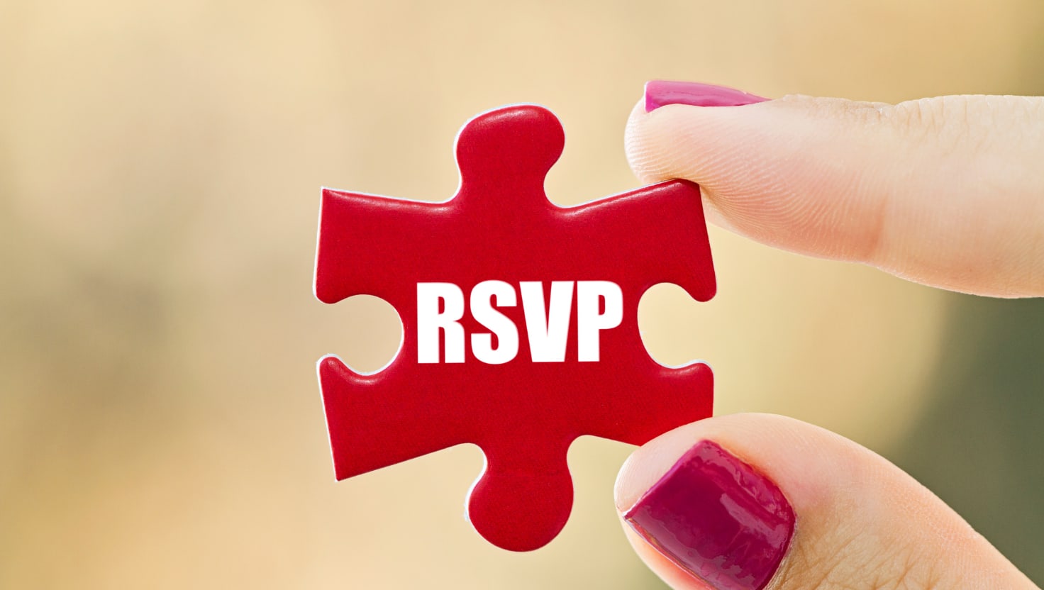 RSVP_puzzle_piece RSVP written in white letters on a red puzzle piece.